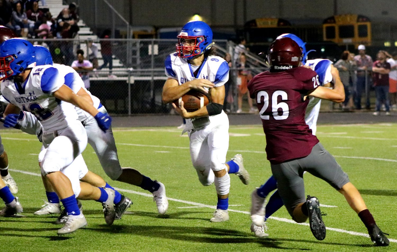 Quitman’s Mason Reynolds (8) looks for room to run against Arp Friday night. See story Page 8A.